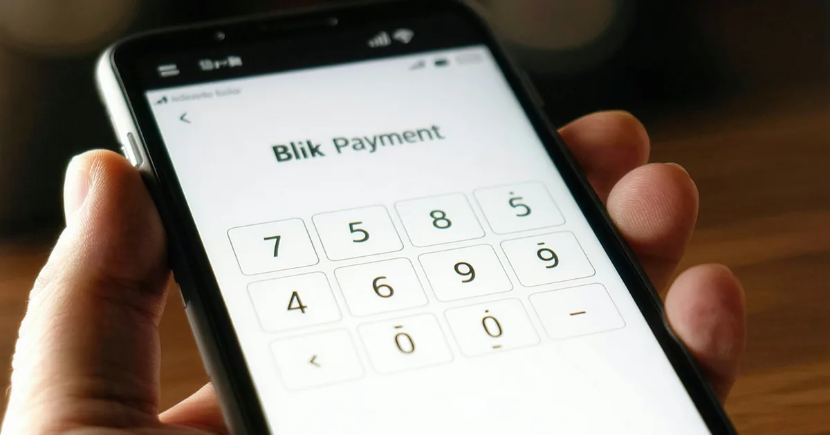 Smartphone screen showing Blik payment code during ticket checkout